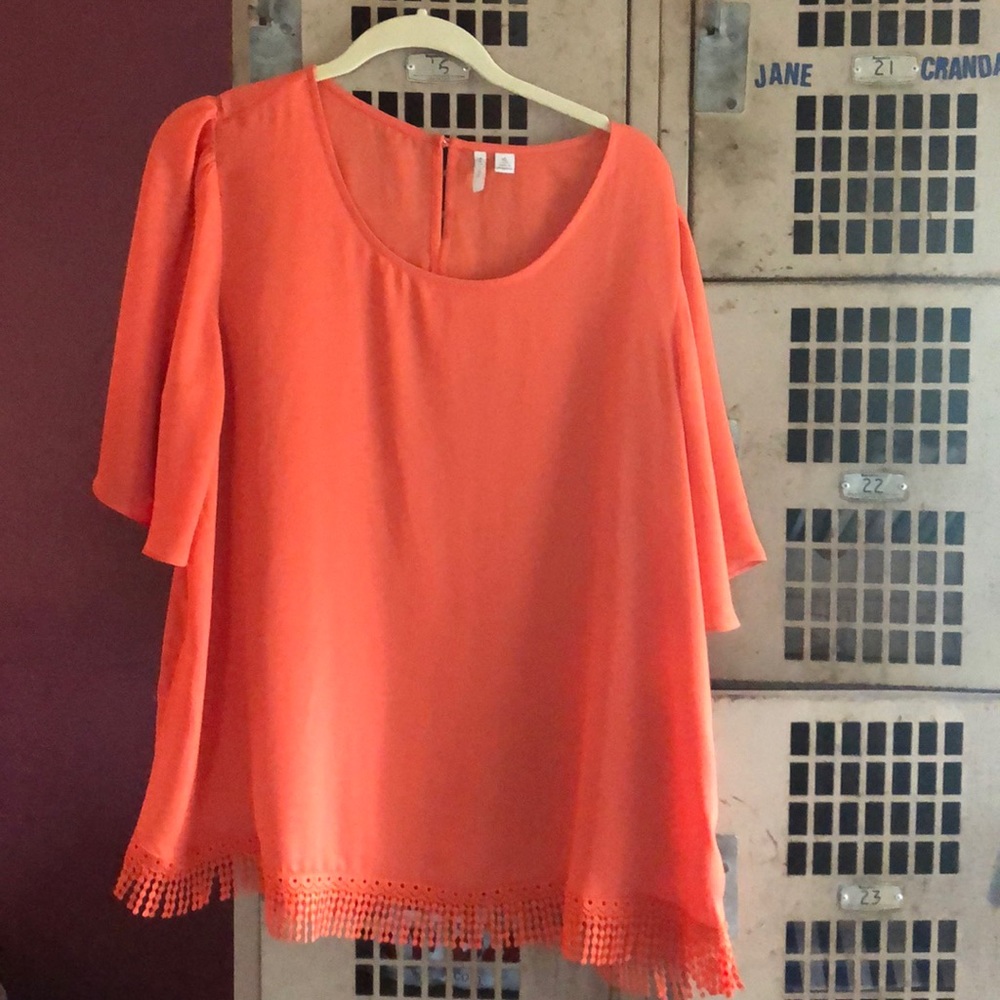 Super cute Orange blouse with decorative bottom